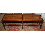 A polished as walnut cane seat window stool, on six turned and stretchered supports, 48" long