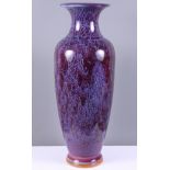 A Chinese pottery Jun design baluster vase with everted rim and purple glaze, on circular foot, seal
