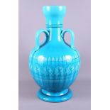 A Burmantofts turquoise glazed three-handled vase (now converted to a table lamp and restored),