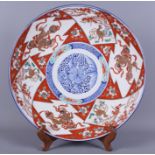 A Japanese Imari charger with Dog of Fo and floral decoration, 15" dia