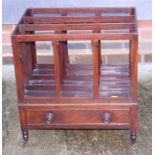 A 19th century mahogany canterbury, fitted drawer with knob handles, on turned and castored