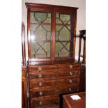 A George III mahogany secretaire bookcase, the upper section enclosed lattice glazed doors over