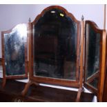 A walnut framed triple-plate toilet mirror of Queen Anne design, 20" wide, and an oval swing frame