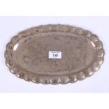 A 20th century Mexican silver scalloped edge tray with alternate panels embossed with floral