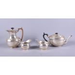 A matched George V silver four-piece tea and coffee service comprising hot water pot, teapot, milk