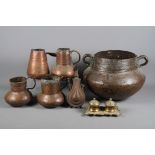An Indian two-handled copper vessel together with various other copper items and an Eastern copper