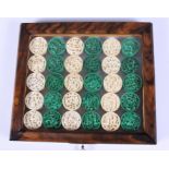 A set of thirty mid 19th century Chinese stained ivory gaming counters, each set of five carved with