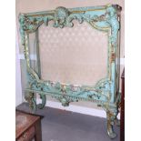 A Venetian design carved, painted and gilt display cabinet with figures and scrolls, on shaped