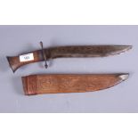 An Indian? kukri type blade with carved hardwood scabbard