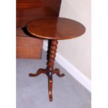 A 19th century walnut oval wine table, on bobbin turned column and tripod splay supports, 21" wide