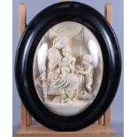A late 19th century high relief plaster panel, depicting Virgin and Child, bearing signature