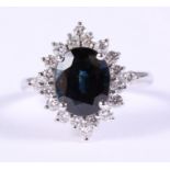An 18ct white gold sapphire and diamond cluster ring, central sapphire 5.21ct, ring size S/T, 6.3g