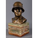 A bronze bust of an SS Soldier, on an onyx plinth, signed, 8” high