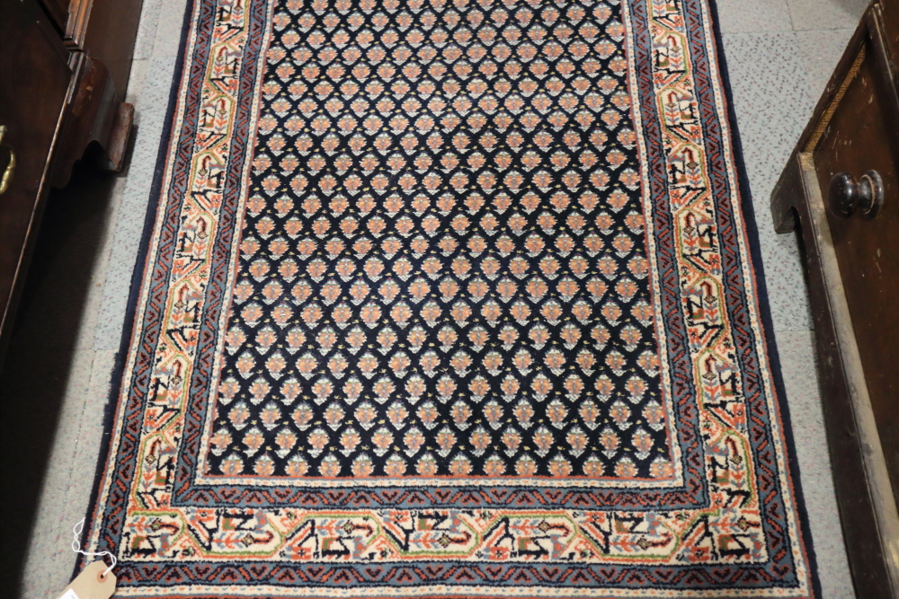 A Persian runner with all-over boteh design on a blue ground and multi-bordered in shades of red, - Bild 2 aus 3
