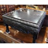 A Chinese carved hardwood coffee table, on paw feet, 23" square
