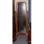 A walnut cheval mirror of Queen Anne design with shaped bevelled plate, 14" x 47", on splay