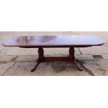 A Stuart Linford mahogany and oak extending dining table and splayed supports, top 104" x 44" when