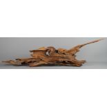 A naturalistic piece of Japanese driftwood, impressed signature verso, 52" long