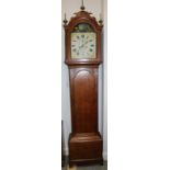 A late Georgian provincial oak long case clock with painted arch top dial, rocking boat and eight-