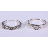 A 9ct white gold ring set solitaire diamond, 0.10ct and a 9ct white gold diamond half eternity hoop