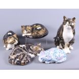 Four Mike Hinton pottery cats, each in different situations, together with a Chinese porcelain cat