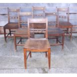 A set of six 19th century ball and bar back standard dining chairs with panel seats, on