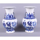 A pair of 19th century Chinese two-handled blue and white porcelain vases, the elongated neck with