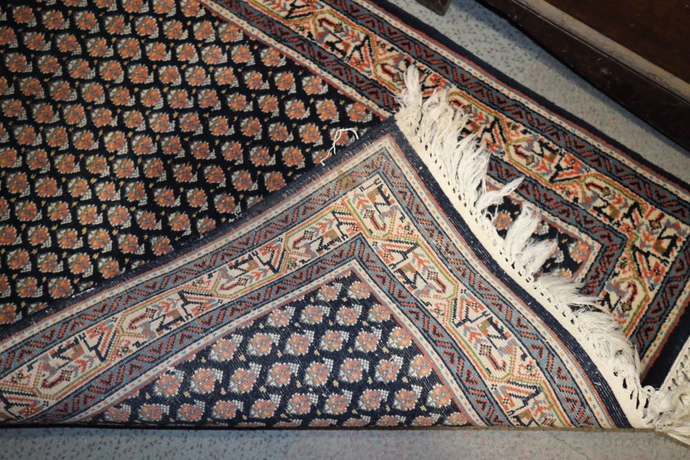 A Persian runner with all-over boteh design on a blue ground and multi-bordered in shades of red, - Bild 3 aus 3