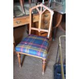 A late 19th century oak standard chair with Gothic style back and stuffed over seat, upholstered