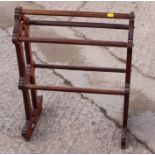 A Victorian mahogany Gothic pierced side towel rail, 20" wide