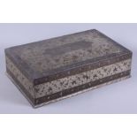 A 19th century Anglo-Indian white metal Bidriware dressing table box, the hinged cover opening to