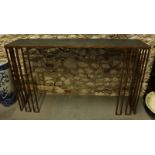 A gilt metal custom-made console table with black marble top, 57" wide x 12" deep