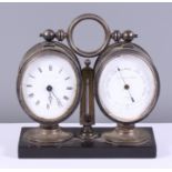 A late 19th century Bryson & Sons silver plated desk clock, barometer and thermometer, on a black