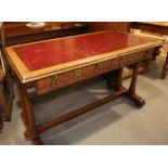 Gillows Lancaster: a Pugin design mid 19th century carved oak writing table with tooled lined top,