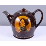A Royal Doulton treacle glaze Kingsware pottery teapot, "The cup that cheers", with hallmarked