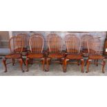 A set of ten Stuart Linford spindle back chairs with panel seats and crinoline stretchered supports