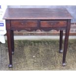 A Georgian oak side table, fitted two drawers, on turned supports and pad feet, 34" wide