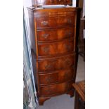 A 1930s walnut bowfront chest of six long drawers, on bracket feet, 22" wide