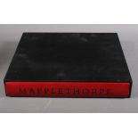 Essay by Arthur C Danto: Mapplethorpe, one vol of various black and white photos, in original box,