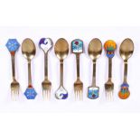 A set of four Danish silver gilt and enamel commemorative spoons and forks by Anton Michelsen,