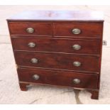 A Georgian mahogany chest of two short and three long graduated drawers, on bracket feet