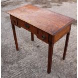 A late Georgian bright mahogany lowboy, fitted two deep and one shallow drawer on chamfered