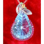 An 18ct white gold pendant with large central blue topaz, 43ct approx, mounted with various