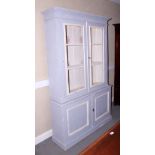 A grey and white painted display cabinet, the upper section enclosed two glazed panel doors over