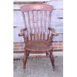 A polished as walnut Windsor farmhouse elbow chair with lath back, on turned and stretchered