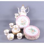 A Continental porcelain dessert service with floral decoration and pink banded borders and a Royal