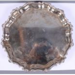 A mid 20th century silver salver with shaped rim, on three scroll feet, Birmingham 1959, 11 1/2"