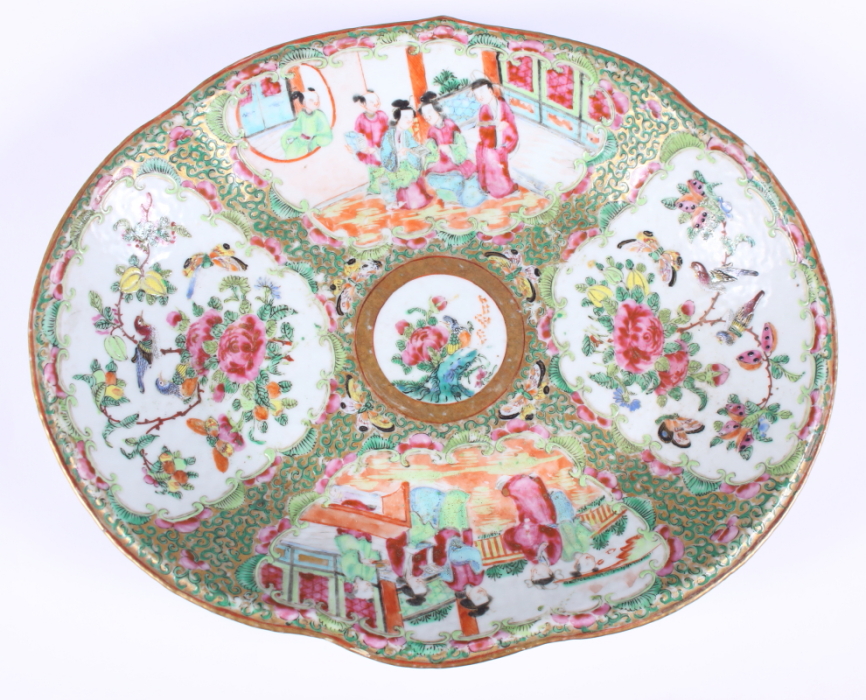 A 19th century Chinese famille rose enamelled lobed dish, decorated with alternating panels of