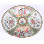 A 19th century Chinese famille rose enamelled lobed dish, decorated with alternating panels of