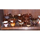 A collection of 19th century copper lustre jugs and a pair of two-handled goblets